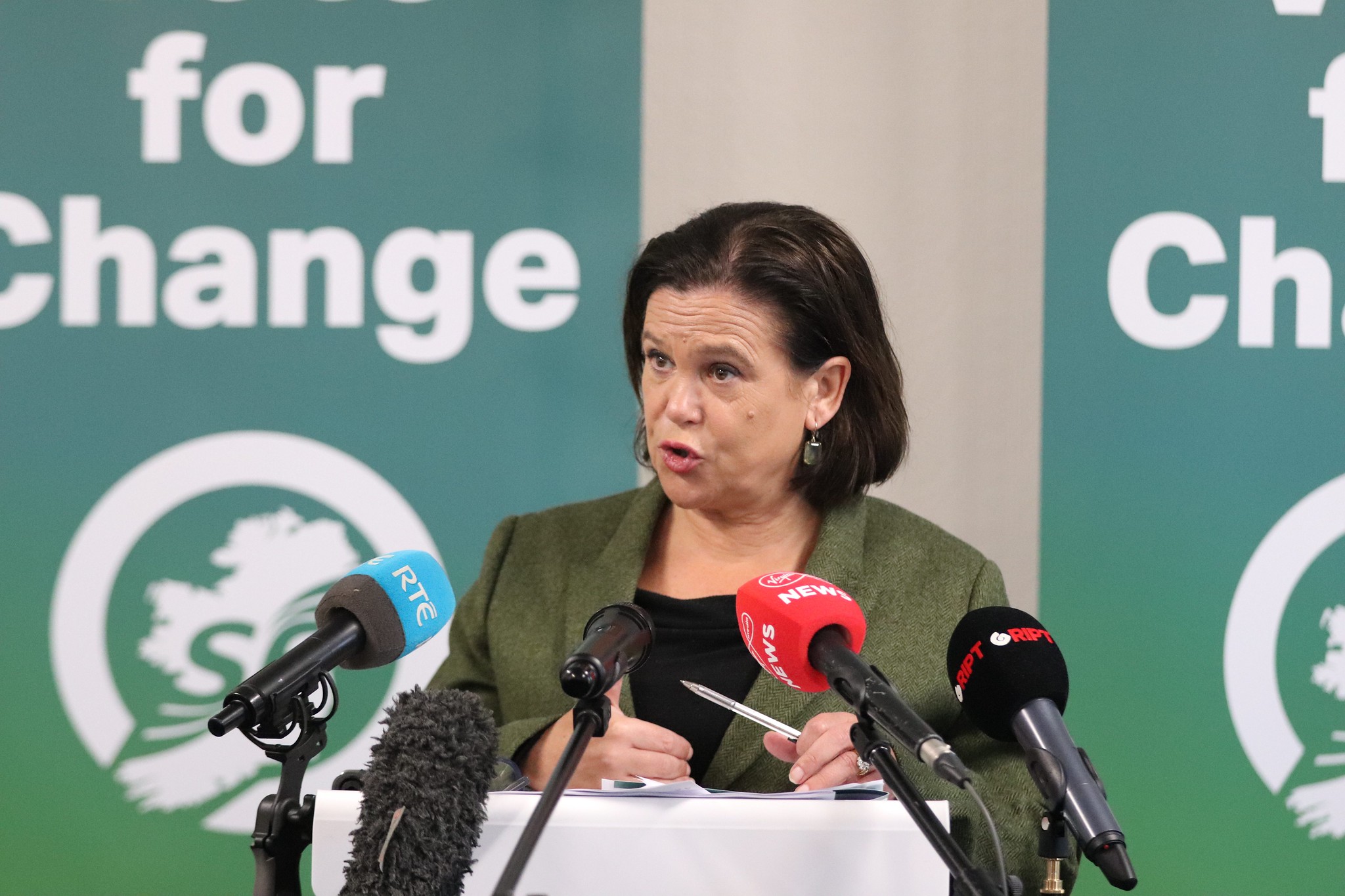 Sinn Fein leader Mary Lou Mcdonald speaking at podium 