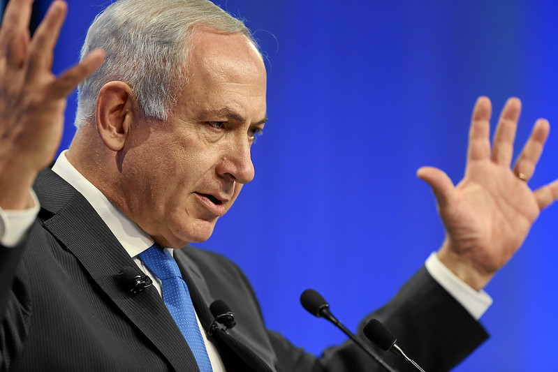 Netanyahu with hand up 